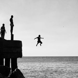 Silhouette of a person jumping in the air